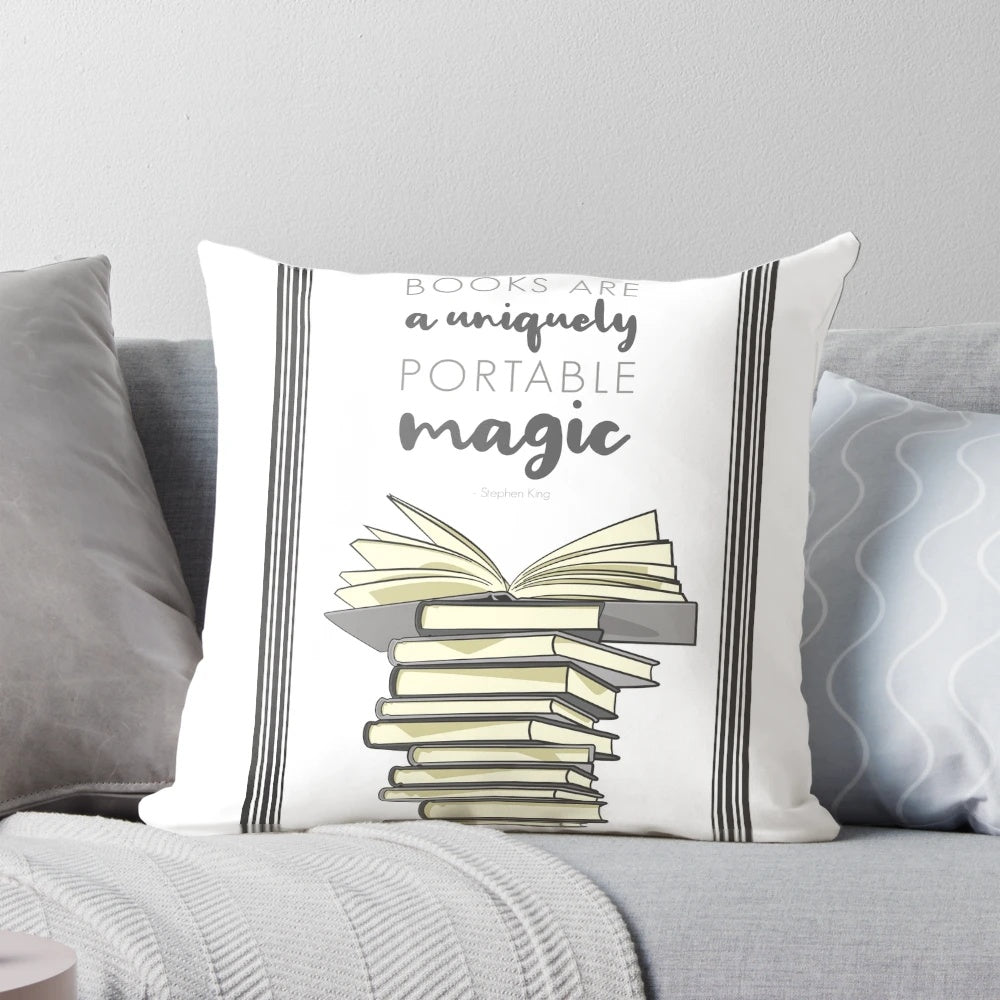 A portable decorative pillow featuring a digital illustration of a stack of books and a book quote.