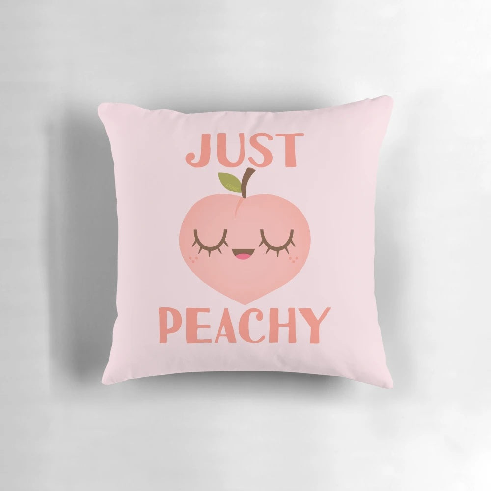 Soft and cozy pillow featuring a cheerful peach illustration, perfect for adding a touch of positivity to any room.