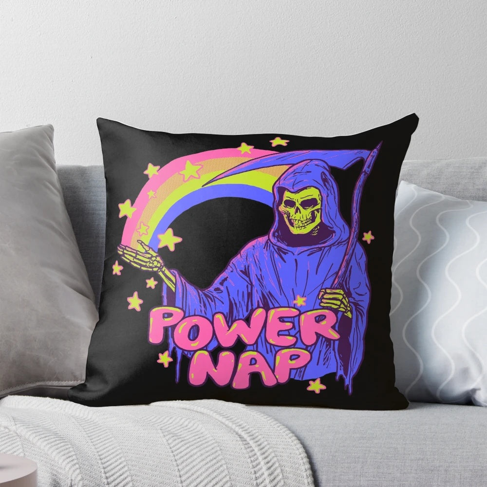A quirky, retro-inspired "Power Nap Pillow" featuring a colorful rainbow design and a playful skull motif.