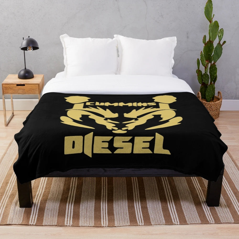 Diesel themed plush blanket with gold, cummins, and engine graphics