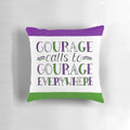 A purple, green, and white pillow featuring the handlettered suffragette quote "Courage Calls to Courage Everywhere" in a bold, inspiring design.