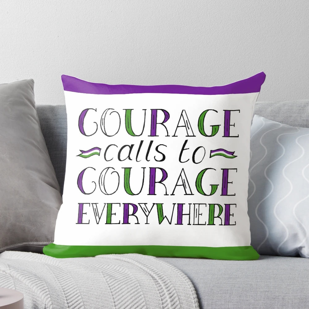 A purple, green, and white pillow featuring the handlettered suffragette quote "Courage Calls to Courage Everywhere" in a bold, inspiring design.