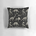 Black and white pillow with a dinosaur fossil design