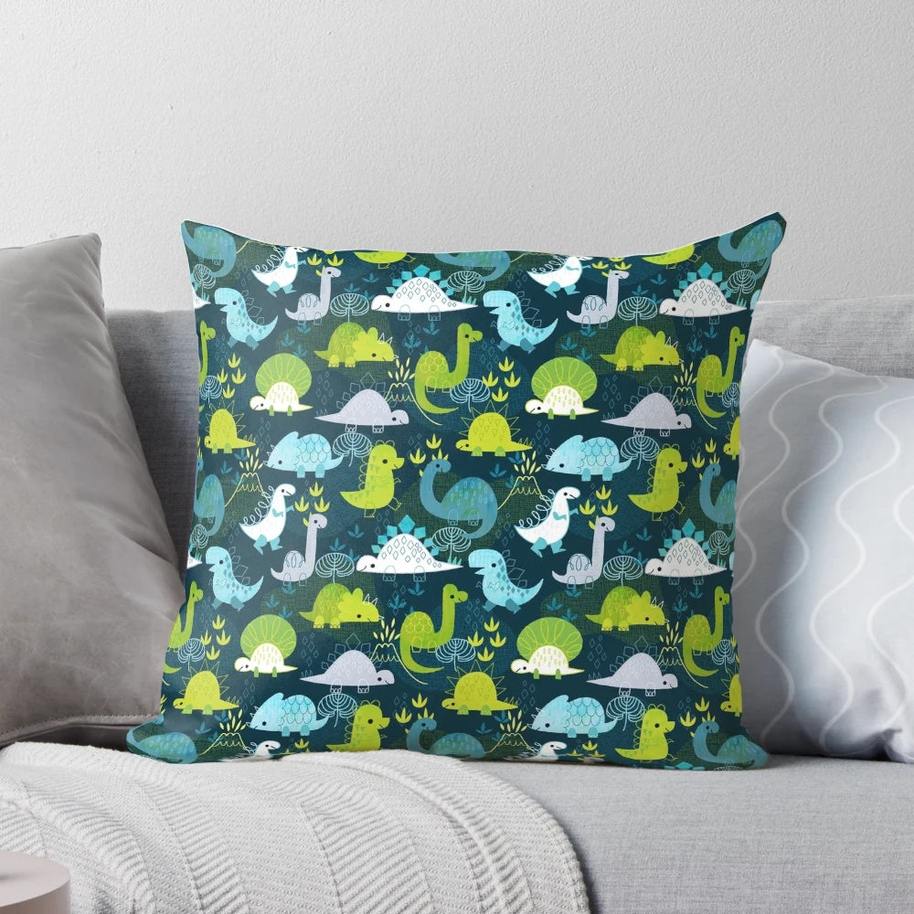 A cozy dinosaur-themed throw pillow featuring a vibrant prehistoric pattern.