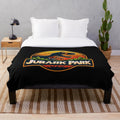 Jurassic Park themed plush blanket with dinosaurs and t-rex