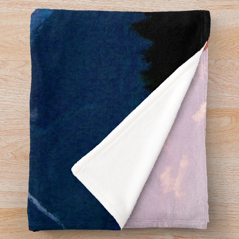Plush blanket featuring a prehistoric flying reptile soaring over a mountain landscape
