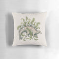 Vibrant pillow featuring a stegosaurus dinosaur surrounded by ferns in a botanical art design.