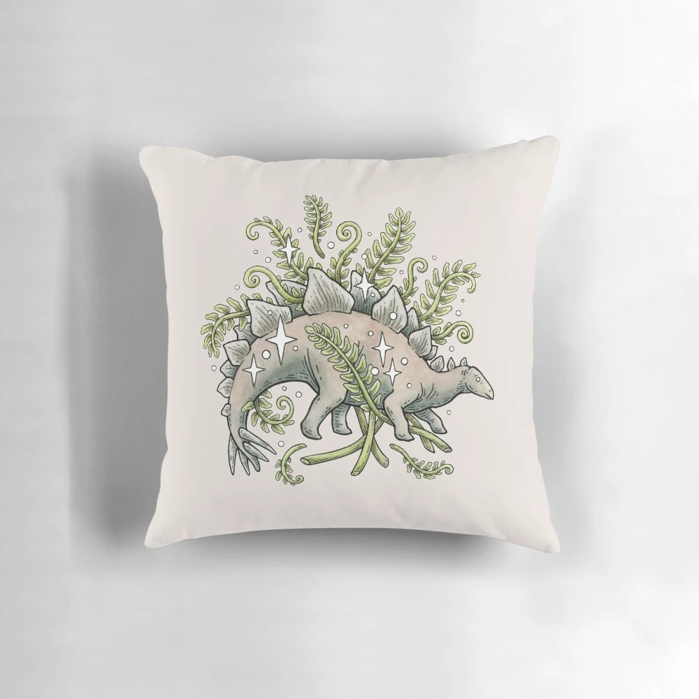 Vibrant pillow featuring a stegosaurus dinosaur surrounded by ferns in a botanical art design.