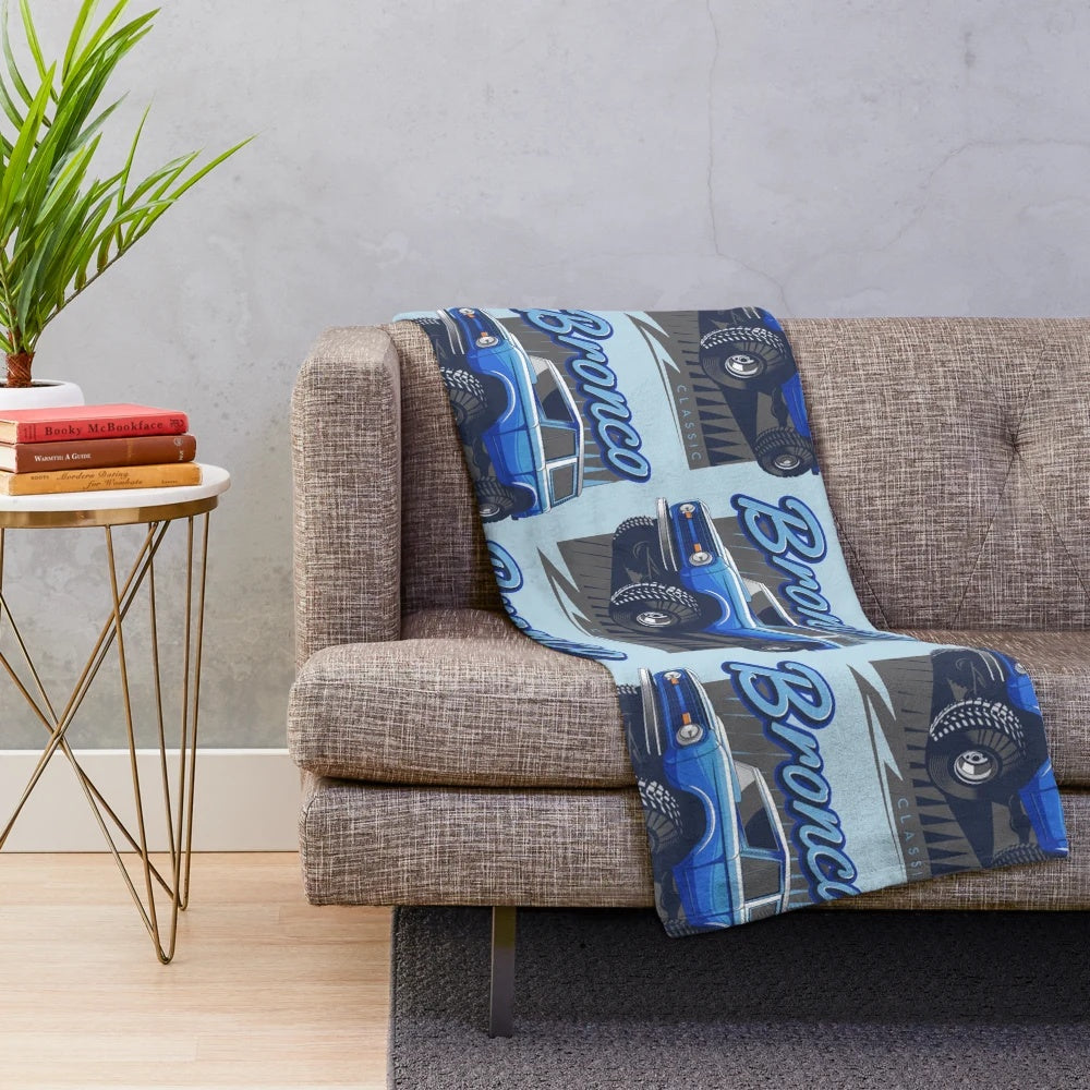 Blue plush blanket featuring a classic Ford Bronco design