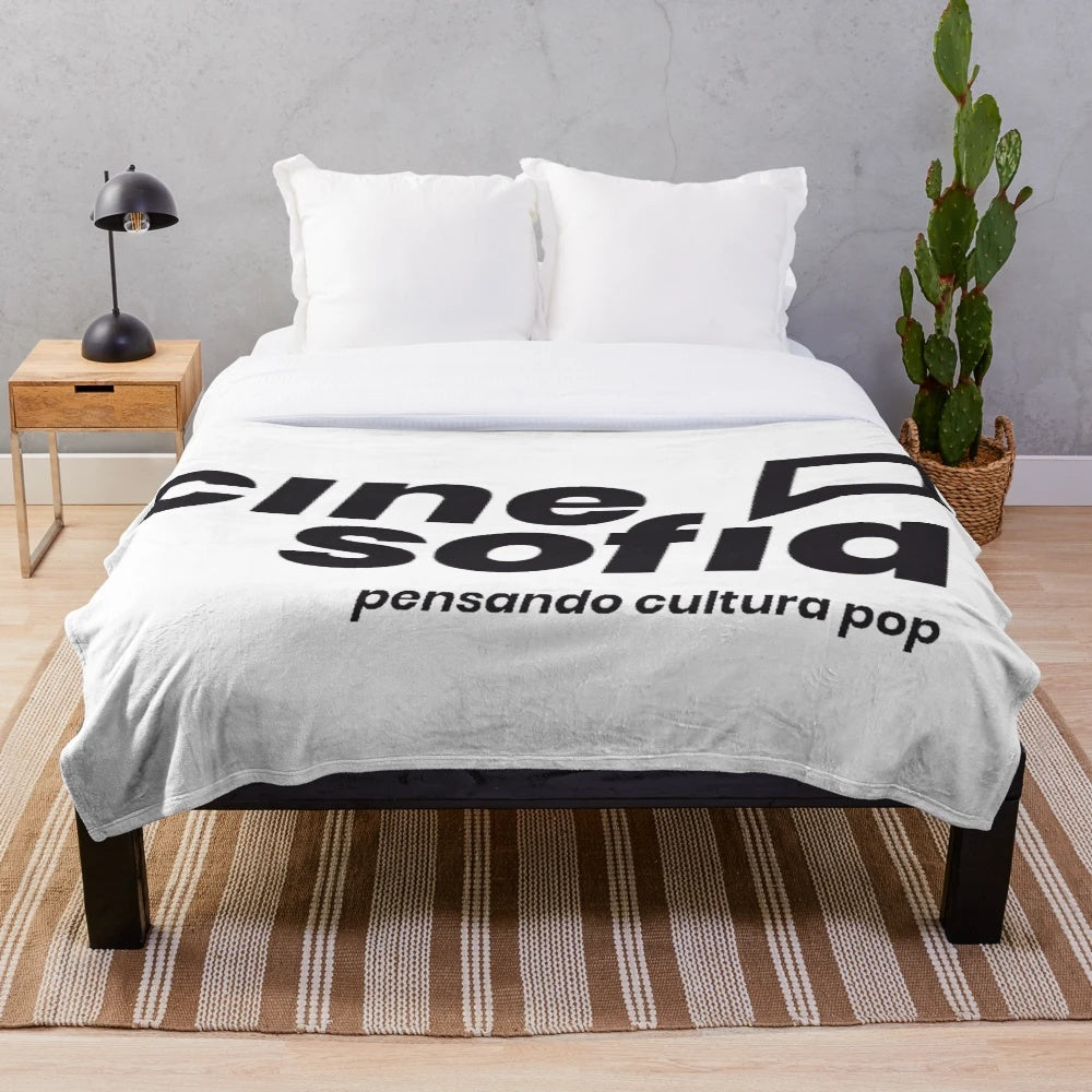 Geometric and trippy plush blanket with Cine Sofia and Filosofia patterns