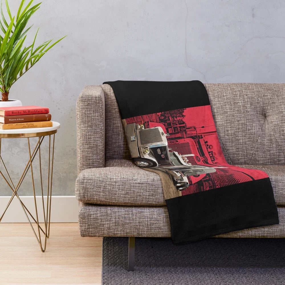 Peterbilt-inspired plush blanket featuring a red background and Peterbilt logo