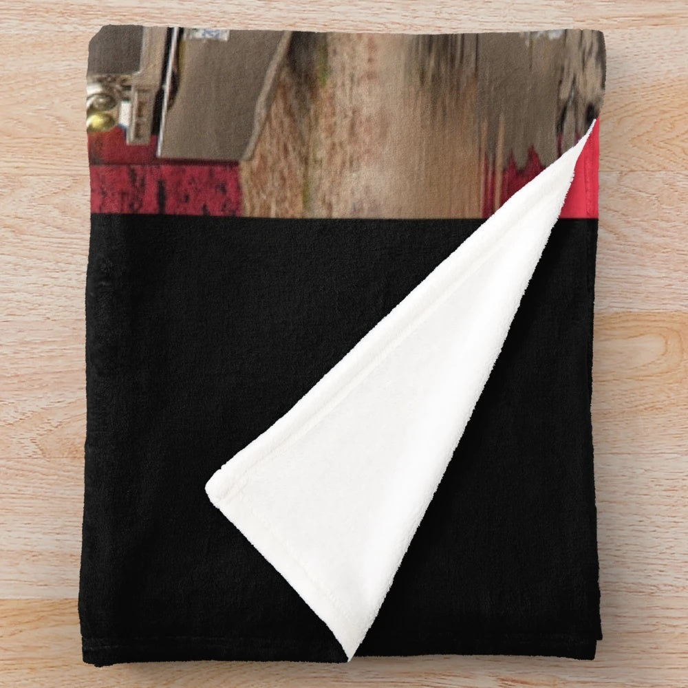 Peterbilt-inspired plush blanket featuring a red background and Peterbilt logo