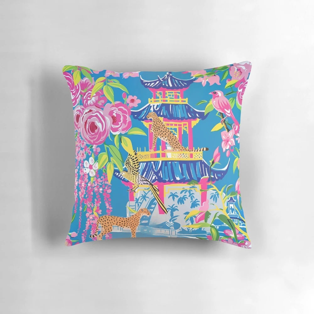 Preppy cheetah print pillow with chinoiserie garden design in shades of cornflower blue and pink