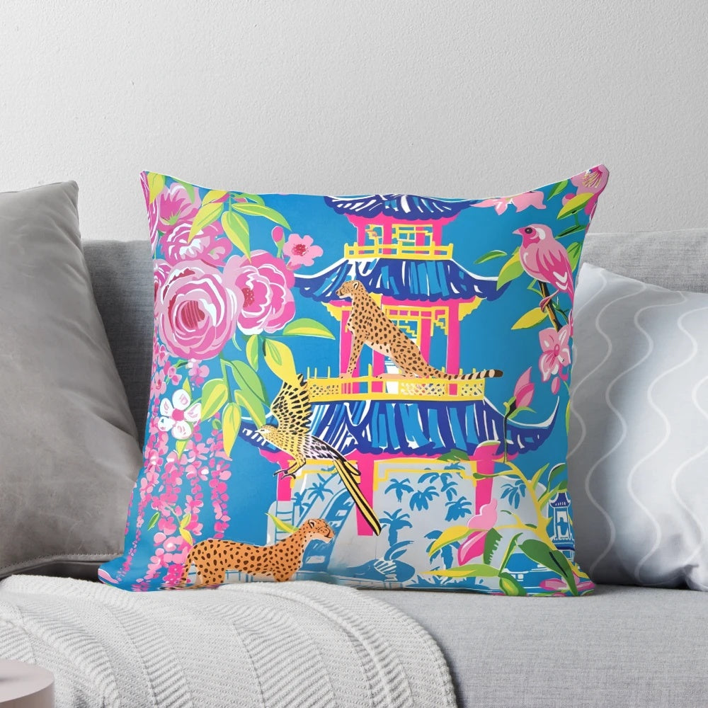 Preppy cheetah print pillow with chinoiserie garden design in shades of cornflower blue and pink