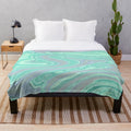 Mint green and pastel plush blanket with marble swirl pattern