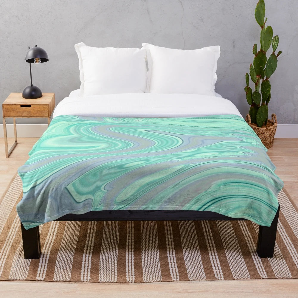 Mint green and pastel plush blanket with marble swirl pattern