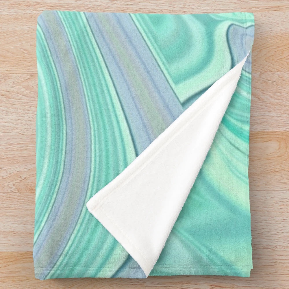 Mint green and pastel plush blanket with marble swirl pattern