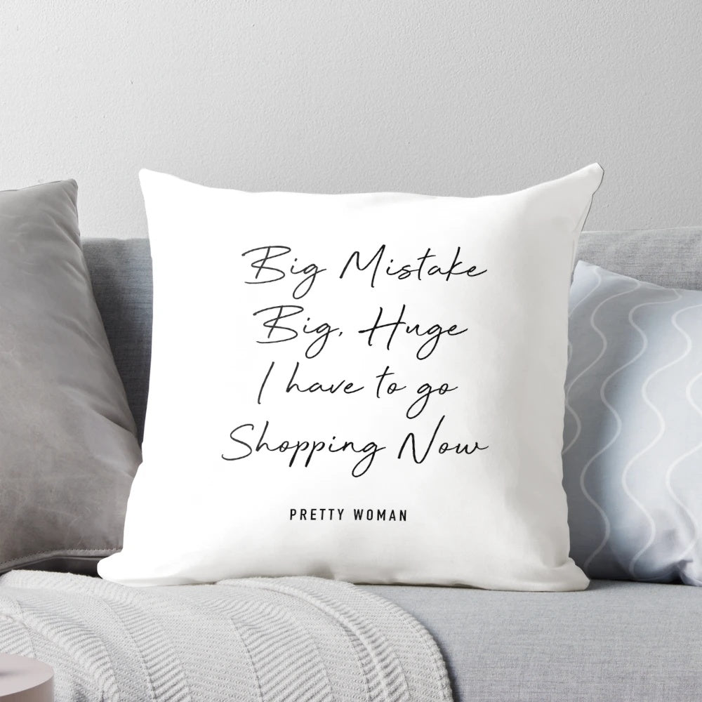 Decorative throw pillow with "Pretty Woman" movie quote about shopping and fashion