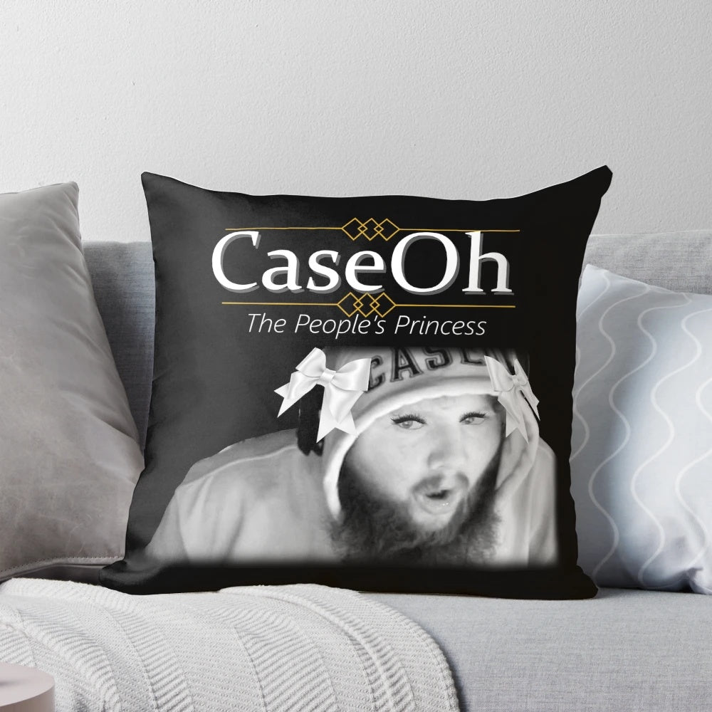 A black and white image of a pillow featuring a parody design of Princess Diana.