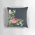 Closeup of a blue and pink protea flower print on a decorative pillow