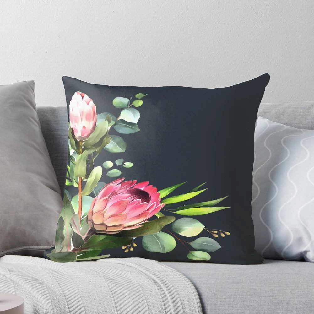 Closeup of a blue and pink protea flower print on a decorative pillow