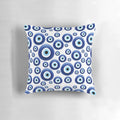 A blue and white patterned pillow with the traditional Mediterranean evil eye design