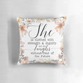 Proverbs 31:25 inspirational pillow with "She is clothed with strength and dignity, and she laughs without fear of the future" bible verse