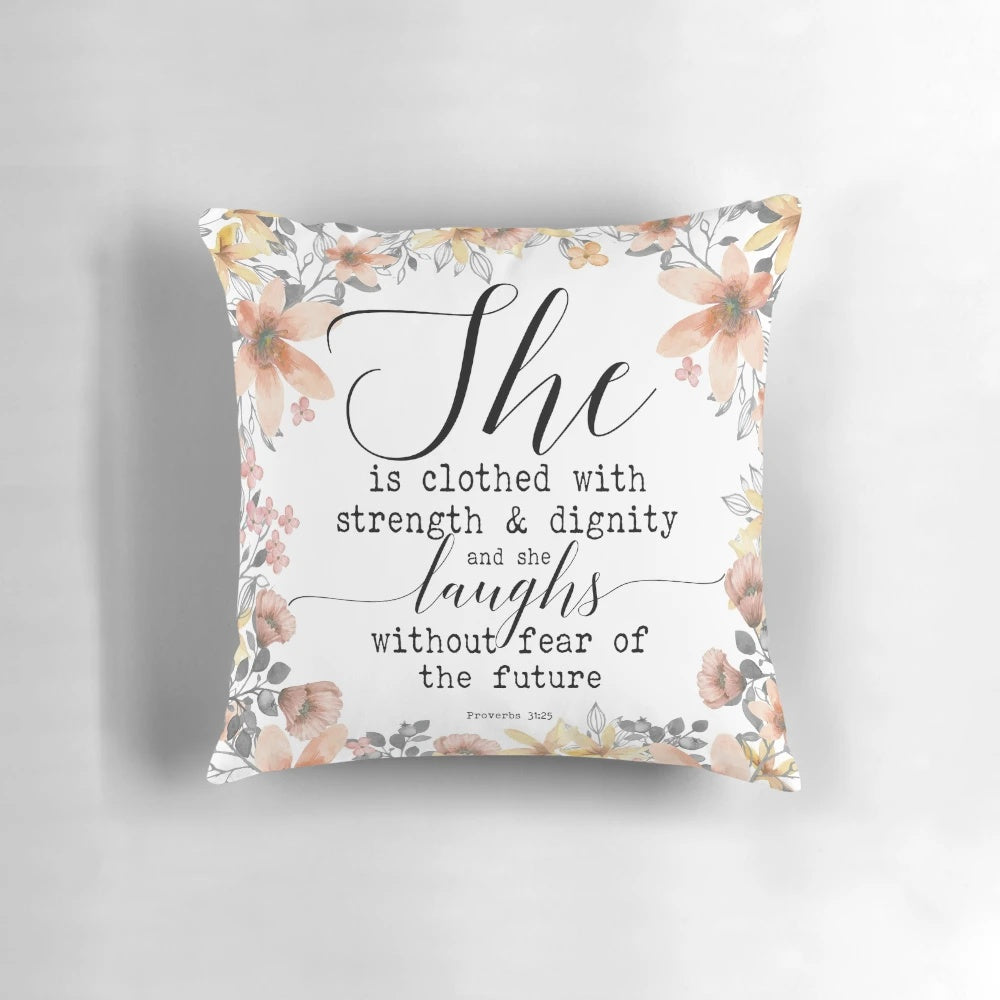 Proverbs 31:25 inspirational pillow with "She is clothed with strength and dignity, and she laughs without fear of the future" bible verse