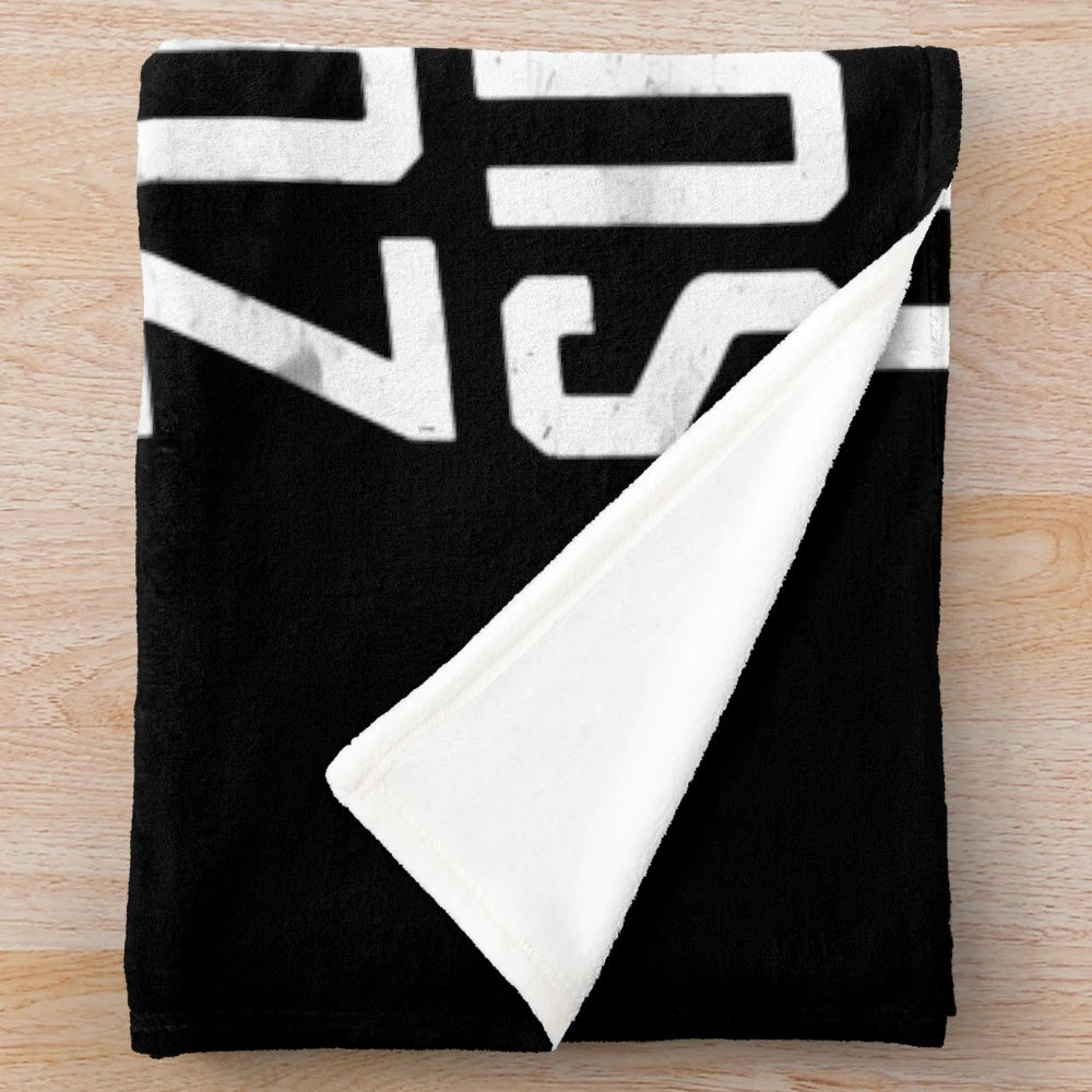 Plush blanket featuring a provocative youth culture statement