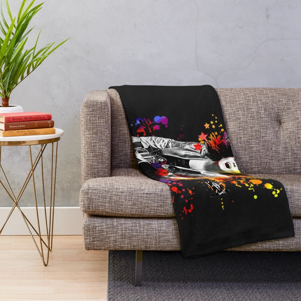 Vibrant paint splatter plush blanket featuring the iconic T. Rex frontman Marc Bolan