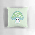 Whimsical green polka dotted mushroom-shaped pillow for kids' room
