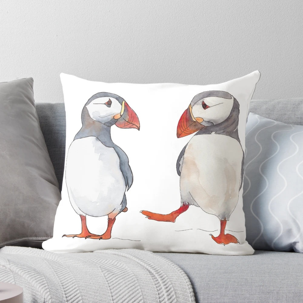 Illustration of puffins dancing and tapping on a decorative pillow
