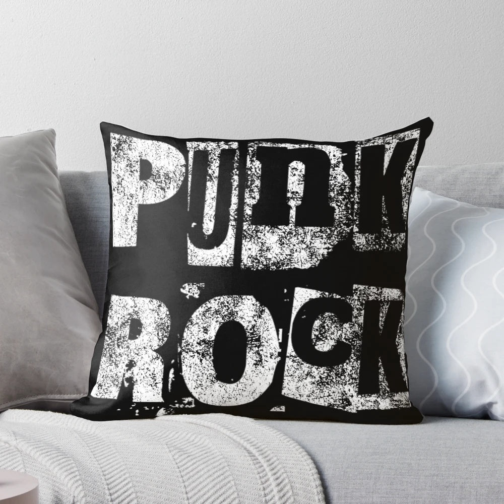 A punk rock-inspired throw pillow with a stencil grunge design, perfect for adding an edgy, grungy touch to your home.