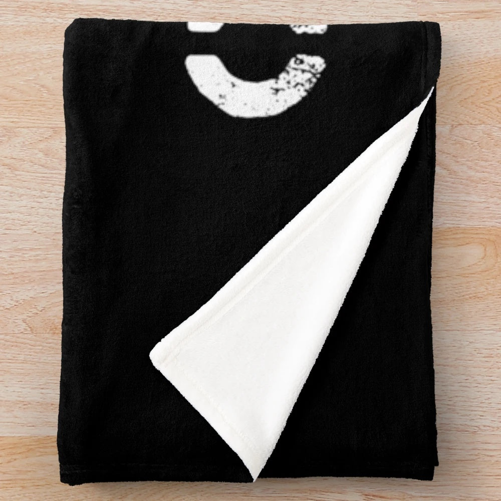 Plush blanket featuring punk rock and anarchy-inspired design