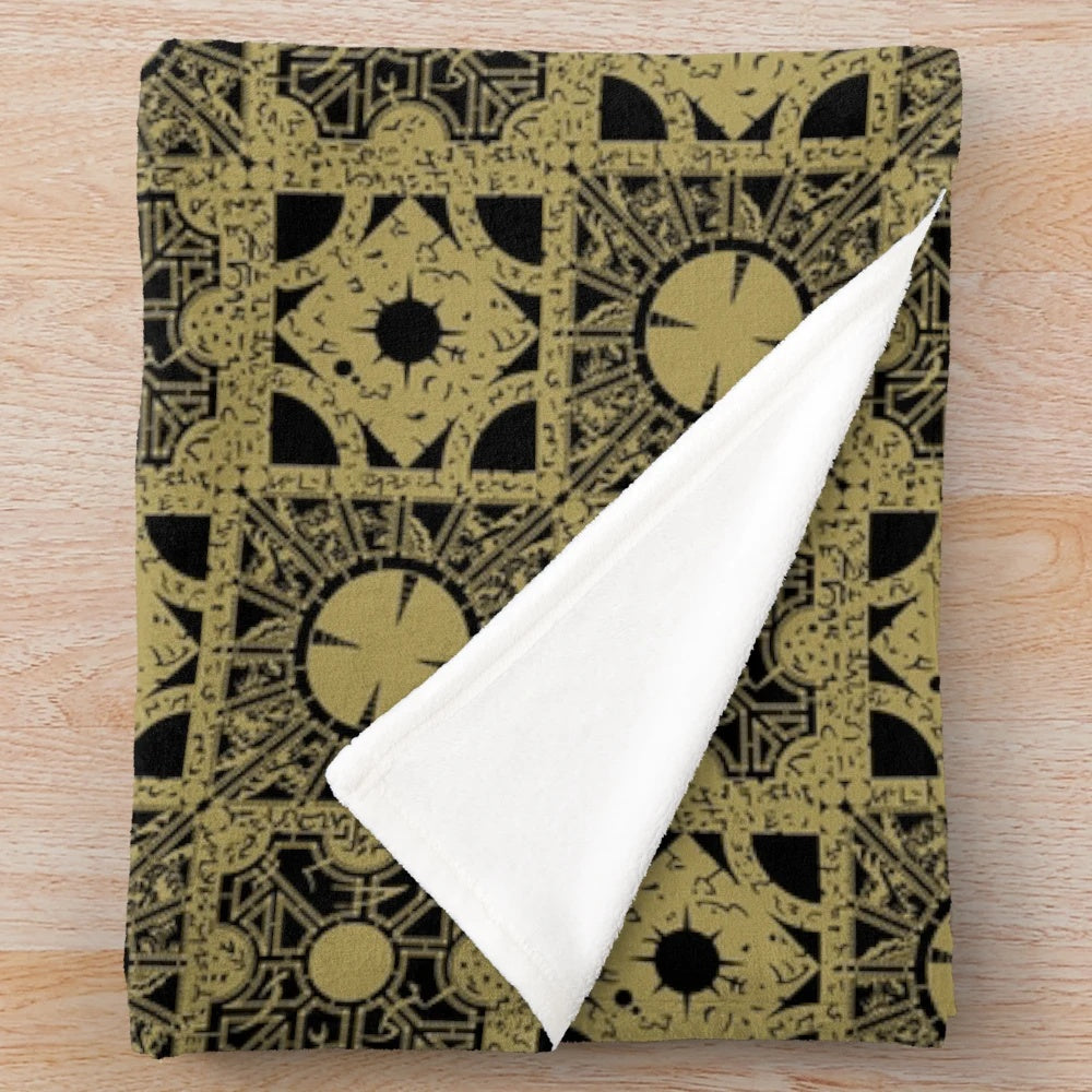 Puzzlebox Pattern Cozy Plush Blanket featuring a horror-inspired design