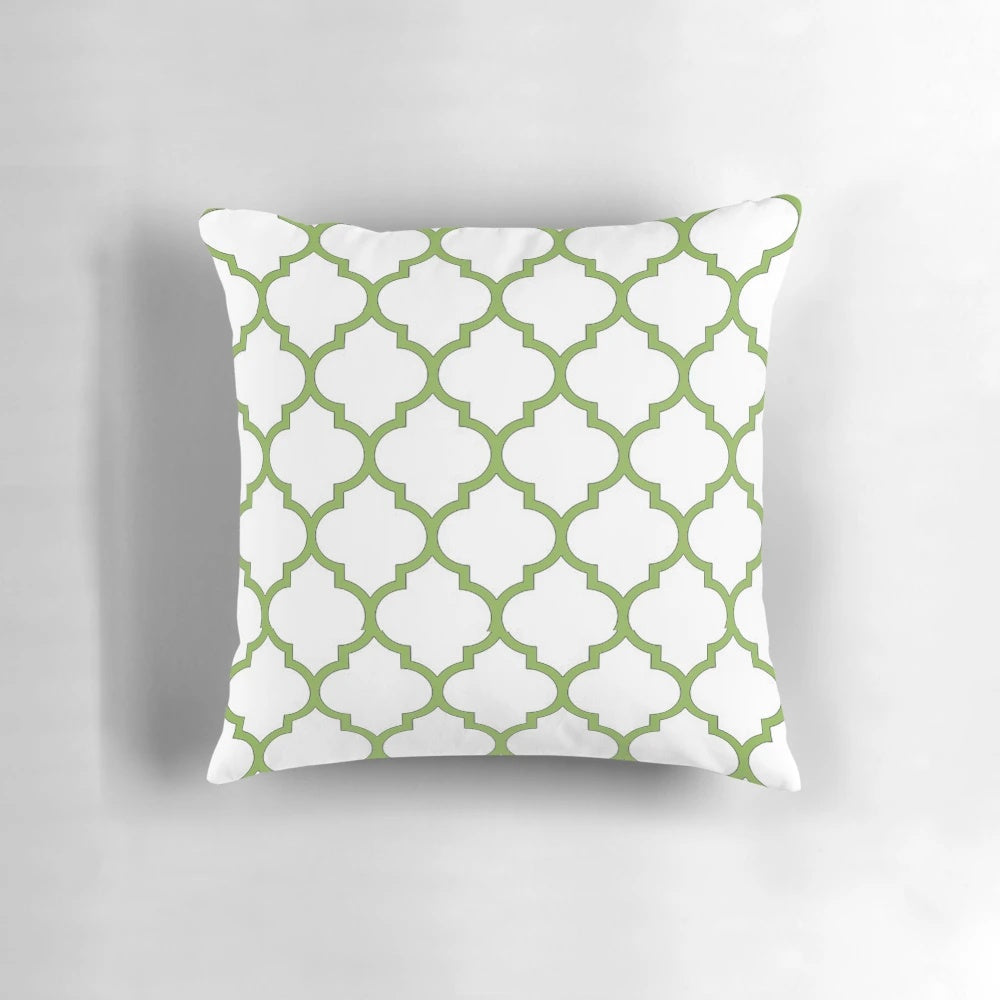 Decorative pillow with a quatrefoil and geometric pattern in the Pantone Color of the Year 2017, Greenery.