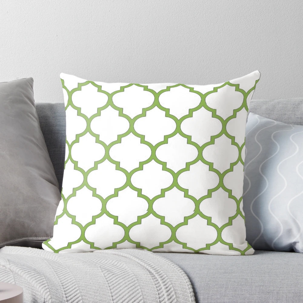 Decorative pillow with a quatrefoil and geometric pattern in the Pantone Color of the Year 2017, Greenery.