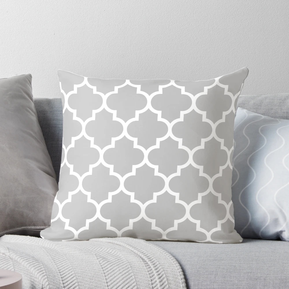 Quatrefoil patterned decorative pillow in silver gray