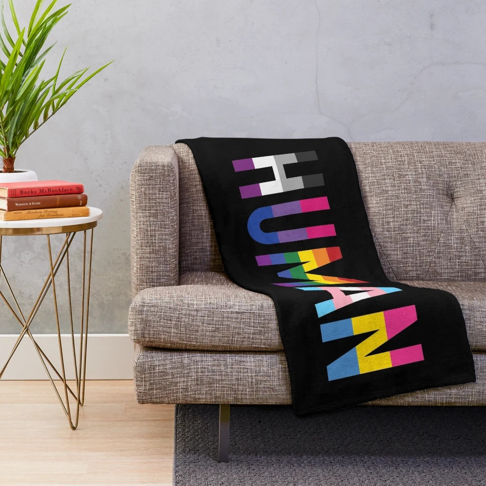 Colorful plush blanket featuring various LGBTQIA+ pride flags