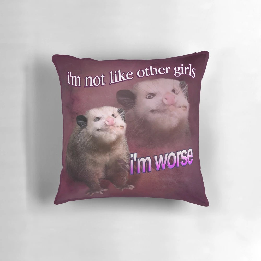 Decorative pillow featuring the text "I'm not like other girls, I'm worse" with a possum graphic and word art design