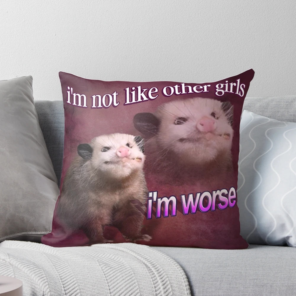 Decorative pillow featuring the text "I'm not like other girls, I'm worse" with a possum graphic and word art design