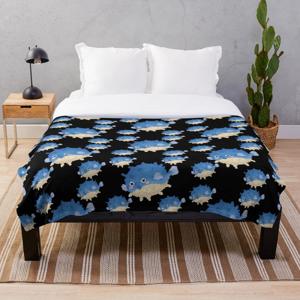 Pixelated pufferfish plush blanket with 8-bit inspired design
