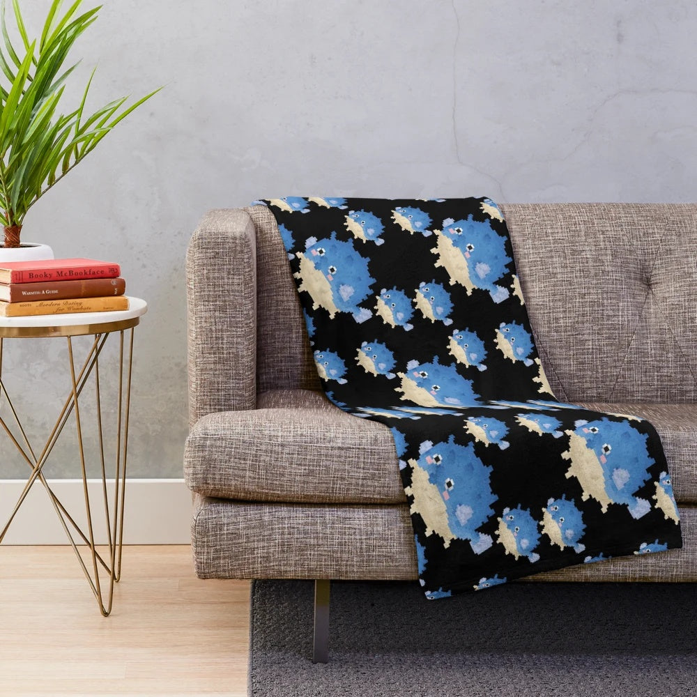 Pixelated pufferfish plush blanket with 8-bit inspired design