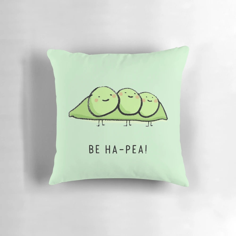 A vibrant and whimsical pillow featuring a cartoon pea character, designed to bring happiness and a positive outlook.