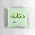 A vibrant and whimsical pillow featuring a cartoon pea character, designed to bring happiness and a positive outlook.