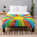 Colorful plush blanket with positive affirmations and vibrant rainbow design