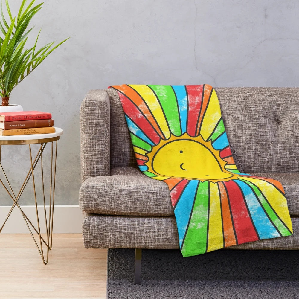 Colorful plush blanket with positive affirmations and vibrant rainbow design