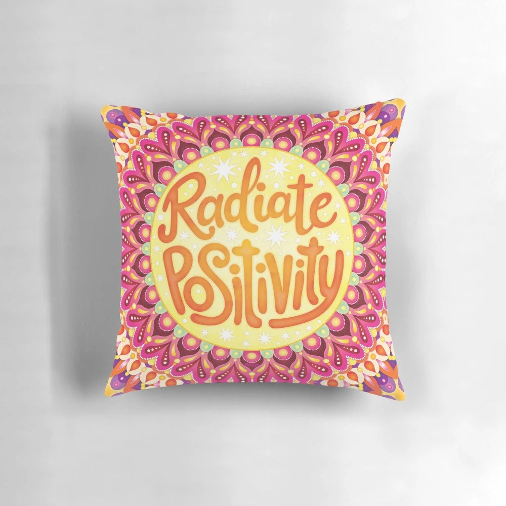 Colorful hand-lettered mandala art pillow with the text "Radiate Positivity