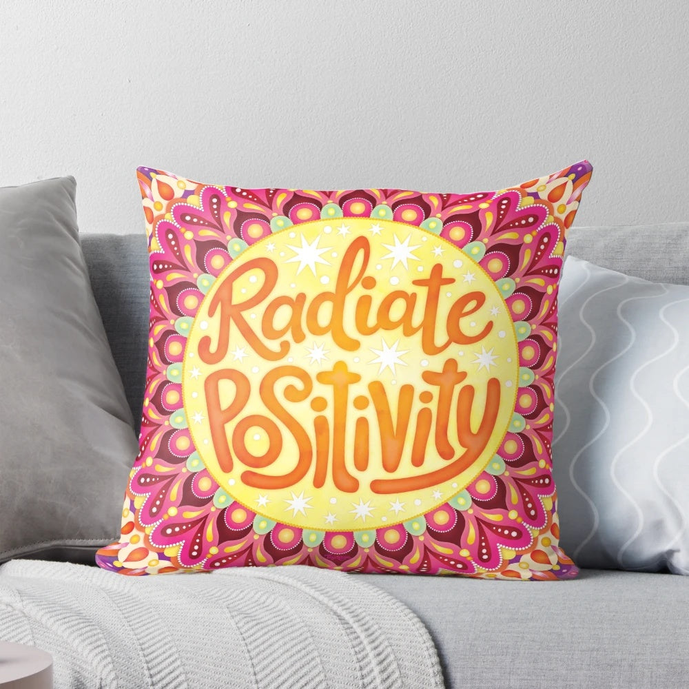Colorful hand-lettered mandala art pillow with the text "Radiate Positivity