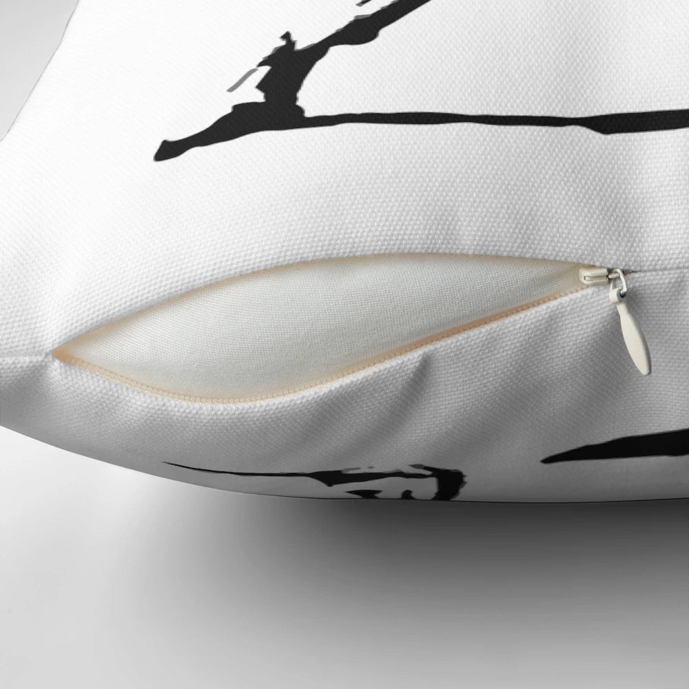 Throw pillow featuring a stencil design of a person throwing a flower, inspired by the Banksy "Flower Bomber" street art.